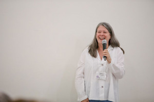 Eileen Flanagan launching with a microphone in hand