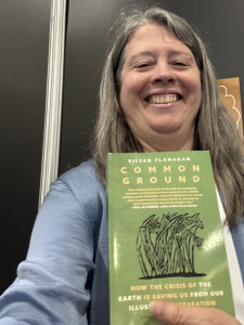 woman with long hair holding new book